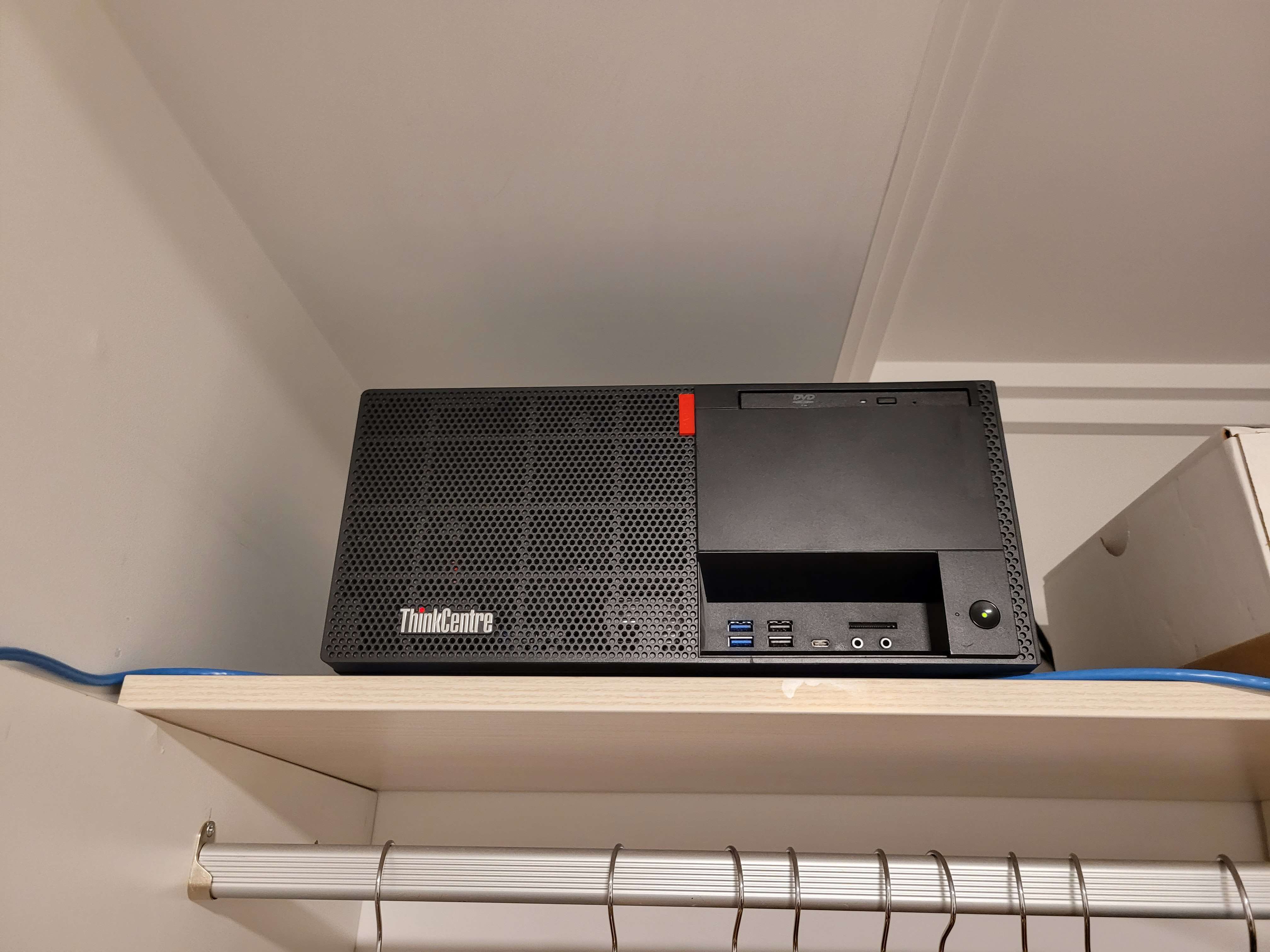 An image of my home server, positioned on top of a wardrobe.
